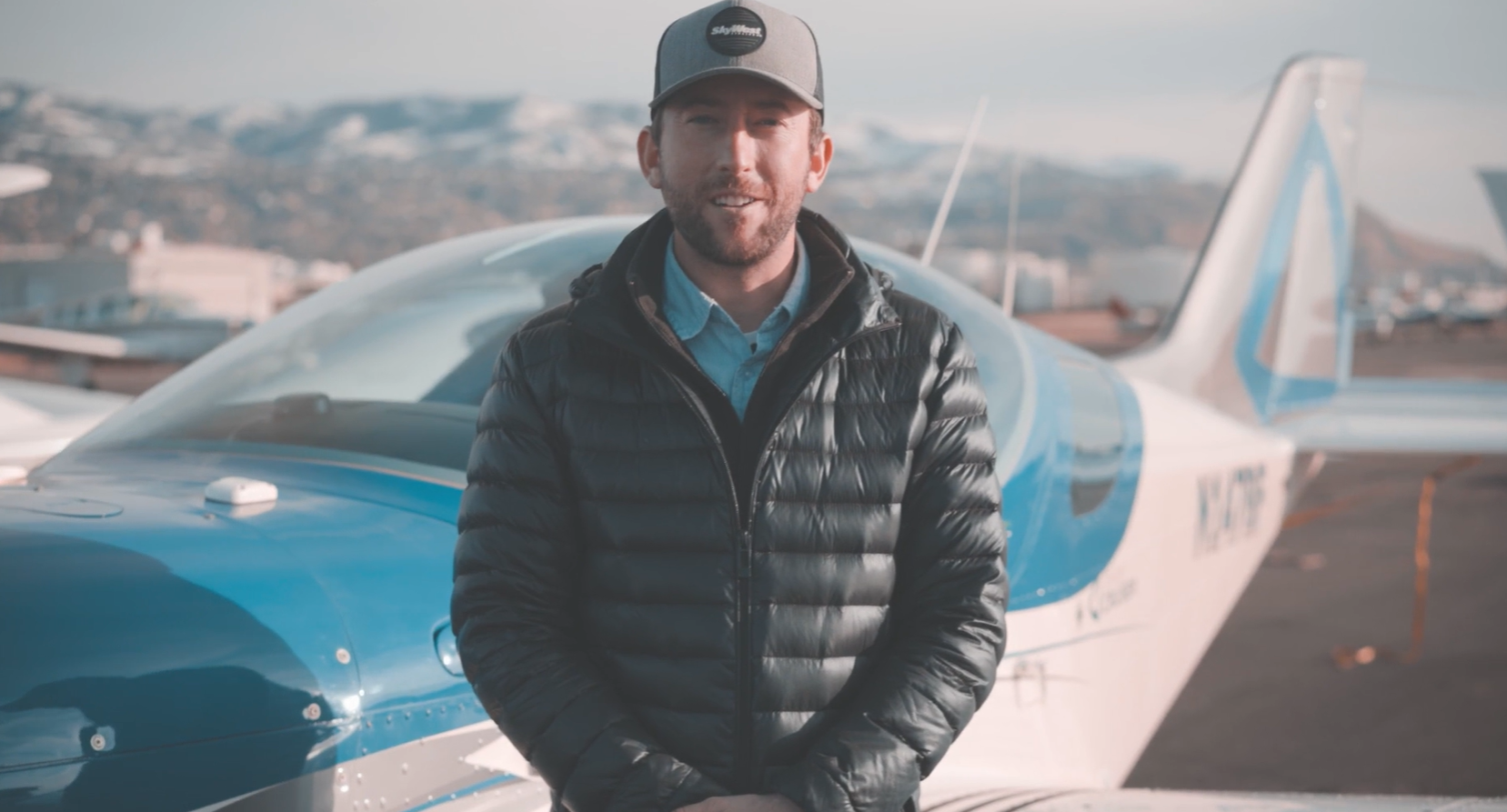 Aviation brand story featuring professional in front of aircraft