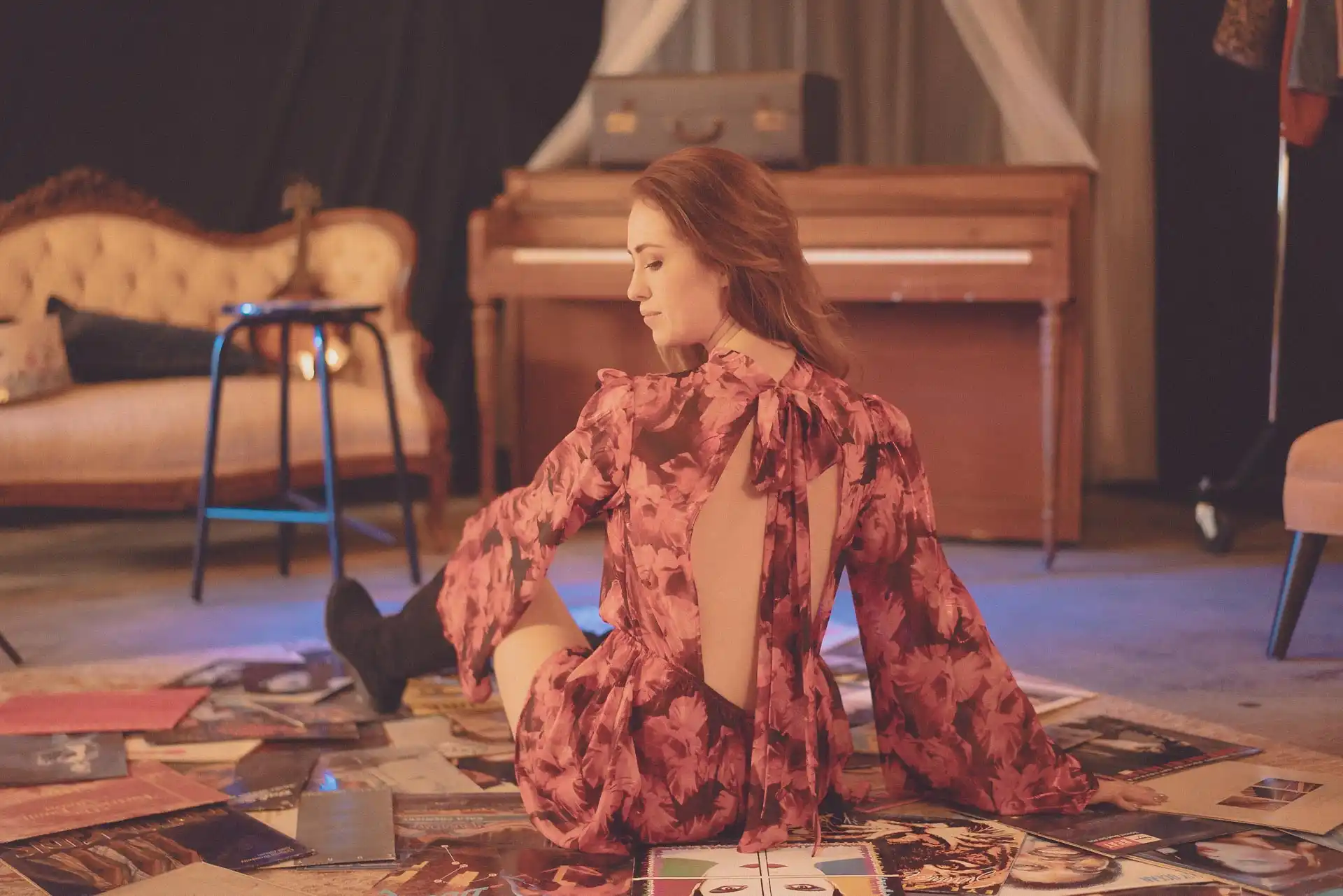 Lifestyle portrait of musician Robyn Cage among vinyl records by GoBig Films